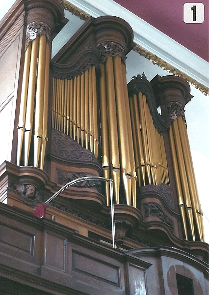 Organ Casework, evidence of white blooming on upper fretwork.