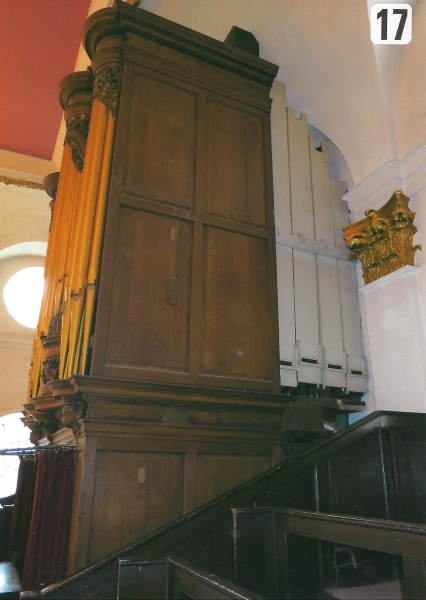 Organ case, treble end, right hand side repairs and damage.